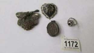 4 items of silver jewellery including locket, brooches etc.