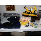 A collection of JCB memorabilia including Border Fine Arts, large teapot, jumpers etc.