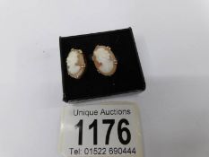 A pair of 9ct yellow gold large cameo earrings.