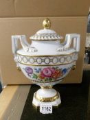 A large signed Dresden two handled porcelain vase with lid.