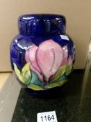 A Moorcroft jar with lid.