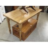 A polished light oak kitchen/dining table.