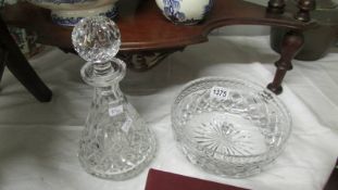 A good glass decanter and glass fruit bowl.