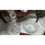 A good glass decanter and glass fruit bowl.