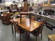 A Nathan solid teak extending dining table and 4 chairs.