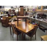 A Nathan solid teak extending dining table and 4 chairs.