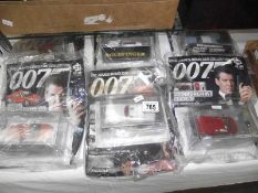 6 sealed James Bond magazines with die cast cars.