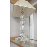 A good quality glass table lamp with shade.