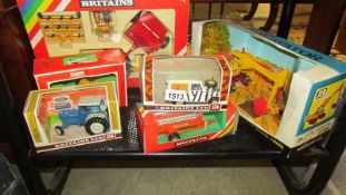 A good selection of boxed Britain's farming vehicles.