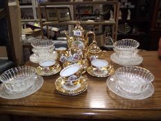 A vintage 15 piece gold coffee set and a 12 piece dessert setting,