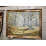 A gilt framed oil on board woodland scene signed R.Oliver.