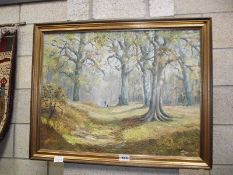 A gilt framed oil on board woodland scene signed R.Oliver.