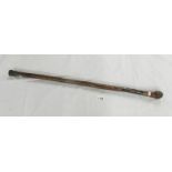 An antique oriental carved bamboo walking stick.