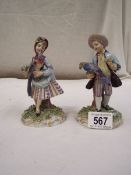 A pair of Italian porcelain figures.