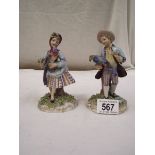 A pair of Italian porcelain figures.