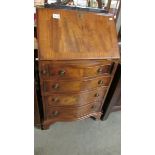 A small mahogany bureau.