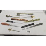 A good collection of letter opener's including Chinese style.