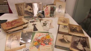 A mixed lot of old postcards, 19th century photographs, ephemera etc.