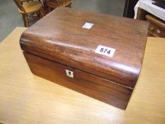 A late Georgian/early Victorian rosewood travelling writing slope with original glass inkwell and