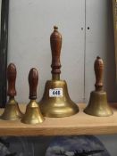 4 wooden handles brass bells