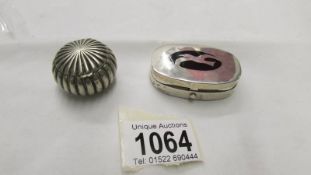 A silver pill box with seagull design and an interesting white metal pill box.