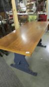 A circa 1940's Maple & Co., oak dining table with painted base.