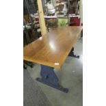 A circa 1940's Maple & Co., oak dining table with painted base.