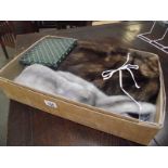 A fur jacket in origjnal box, a fur stole, a small evening bag and hatpins.