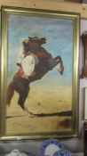 A large framed study of an Arab on a horse.