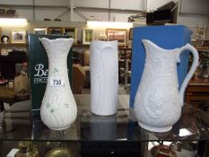 A boxed Belleek case and 2 Kaiser vases (1 boxed).