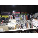 A large quantity of CD's, DVD's, Playstation games etc.