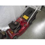 A Mountfield petrol lawn mower.