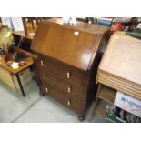 A 1950's oak bureau.