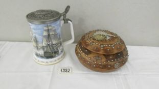 A Royal Worcester commemorative tankard "Nelson Victory" with pewter lid and an African wood box,