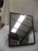 A Victorian mahogany table mirror.