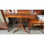 A Victorian mahogany fold over table.