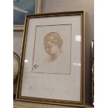 A framed and glazed print of a girls head Musee De Louvre