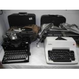 4 vintage typewriters including Royal, Olympia and Hermes.