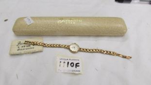 A 9ct gold Bentima 'Star' ladies wristwatch on 9ct gold bracelet.