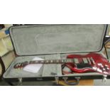 A Epiphone SG Pro electric guitar 'Cherry' left hand with hard case, in good condition with strap,