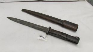 A bayonet in scabbard marked W18.