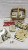 A mixed lot of postcards and cigarette cards etc.