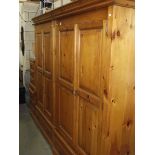 A pine 2 door wardrobe with drawer, another with 2 drawers and 2 three drawer bedside chests.