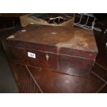 A Victorian mahogany writing box in need of attention.