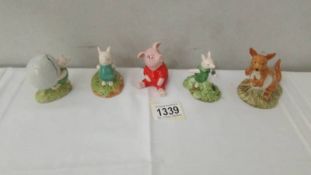 5 Disney Winnie the Pooh figures including 4 Royal Doulton and Beswick piglet.