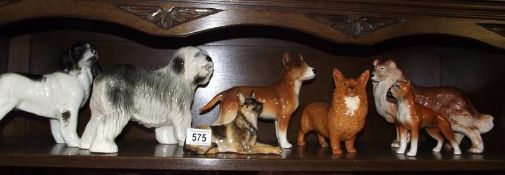 7 ceramic dogs (Beswick Corgi has damaged ear)