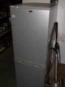 A silver coloured fridge freezer.