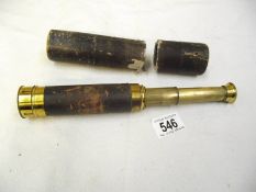 A brass telescope in case, case a/f.