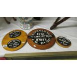 4 cast iron railway plaques on wooden backs.