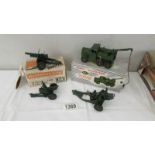 A boxed Dinky 661 recovery tracker, a boxed Britains 25 pound gun and 2 cannons.